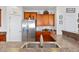 Bright kitchen with stainless steel refrigerator and wood cabinetry at 3426 Kirkwall Dr, Summerville, SC 29485