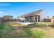 Expansive backyard featuring a screened porch, patio with outdoor seating, and a well-maintained lawn at 407 Squire Pope Rd, Summerville, SC 29486