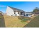 A spacious backyard that features a screened in porch, an open patio, and a well-maintained lawn at 407 Squire Pope Rd, Summerville, SC 29486