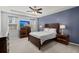 Comfortable bedroom with tray ceilings, ceiling fan, large window and beautiful dark wood bedroom furniture set at 407 Squire Pope Rd, Summerville, SC 29486