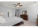 Beautiful bedroom with tray ceiling, fan, carpeting, walk-in closet, and modern, well-maintained furniture set at 407 Squire Pope Rd, Summerville, SC 29486