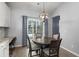 Eat-in dining area with a modern chandelier and a view of the backyard at 407 Squire Pope Rd, Summerville, SC 29486