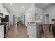 Modern kitchen with white cabinets, stainless steel appliances, granite countertops, and eat-in dining area at 407 Squire Pope Rd, Summerville, SC 29486
