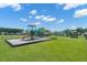 A community playground featuring a slide and swings surrounded by well-maintained green space at 407 Squire Pope Rd, Summerville, SC 29486