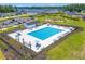 Aerial view showcasing the community pool area with ample lounge chairs, tables, and a covered pavilion at 407 Squire Pope Rd, Summerville, SC 29486