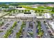 Aerial view of a shopping center anchored by a Publix with ample parking and surrounding businesses at 407 Squire Pope Rd, Summerville, SC 29486