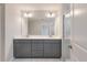 Main bathroom featuring a double vanity, quartz countertops, and luxury vinyl tile flooring at 431 Duskywing Dr, Goose Creek, SC 29445