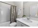 Bright bathroom with white cabinets, shower and tub and fresh decor accents at 454 Pender Woods Dr, Summerville, SC 29486
