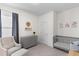 Calm Bedroom featuring a gray crib, cozy chair, and neutral color scheme, creating a serene space at 454 Pender Woods Dr, Summerville, SC 29486