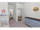 Neutral Bedroom featuring a gray dresser and open doorway, with playful decor and cozy carpeting at 454 Pender Woods Dr, Summerville, SC 29486