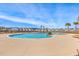 Inviting community pool with clear blue water, surrounded by palm trees and well-maintained landscaping at 454 Pender Woods Dr, Summerville, SC 29486