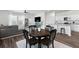 Cozy dining area with modern furnishings adjacent to the living area at 454 Pender Woods Dr, Summerville, SC 29486
