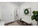 Welcoming entryway featuring wood-look flooring, a decorative wreath, and a view into the living area at 454 Pender Woods Dr, Summerville, SC 29486