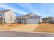 Attractive single-Gathering home featuring a gray siding, white garage door, and well-kept lawn at 454 Pender Woods Dr, Summerville, SC 29486