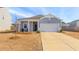Charming single-story home with a welcoming front porch and well-manicured lawn at 454 Pender Woods Dr, Summerville, SC 29486