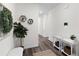 Stylish foyer features wood-look floors, decorative wall decor, and ample natural light at 454 Pender Woods Dr, Summerville, SC 29486