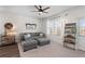 Inviting living room featuring a large sectional sofa, neutral carpet, and plenty of natural light at 454 Pender Woods Dr, Summerville, SC 29486