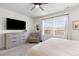 Comfortable main bedroom with a light dresser and an upholstered reading chair by a bright window at 454 Pender Woods Dr, Summerville, SC 29486