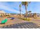 Community playground featuring vibrant play structures and lush landscaping at 454 Pender Woods Dr, Summerville, SC 29486
