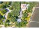 Overhead view of waterfront homes, lush trees, and private docks along the serene coastline at 528 Wampler Dr, Charleston, SC 29412