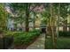 Apartment building exterior with lush green landscaping and inviting walkway at 600 Bucksley Ln # 106, Charleston, SC 29492