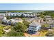Aerial view of the community showcasing a waterfront view and proximity to local bridge at 74 Sandbar Ln, Folly Beach, SC 29439