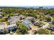 Stunning aerial view of the coastal neighborhood with lush greenery and beautiful homes near the ocean at 74 Sandbar Ln, Folly Beach, SC 29439