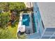 Aerial view of a luxury home featuring a private pool, patio, and well-manicured backyard at 74 Sandbar Ln, Folly Beach, SC 29439
