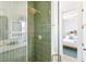 Elegant bathroom showcasing a tiled shower with glass door and brass fixtures at 74 Sandbar Ln, Folly Beach, SC 29439