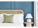 Close-up of a bedroom showing the headboard, pillow, side table, and wall paneling at 74 Sandbar Ln, Folly Beach, SC 29439