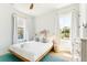 Airy bedroom featuring a modern bed, bright windows, and neutral decor at 74 Sandbar Ln, Folly Beach, SC 29439