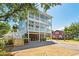 Three story home with double porches and a well maintained yard at 74 Sandbar Ln, Folly Beach, SC 29439