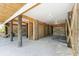 View of the ground-level covered parking area featuring a shed, posts, and concrete floor at 74 Sandbar Ln, Folly Beach, SC 29439