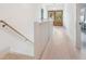 Upstairs hallway with hardwood floors and view of the front doors at 74 Sandbar Ln, Folly Beach, SC 29439