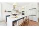 Contemporary kitchen featuring a large island, stainless steel appliances, and stylish lighting at 74 Sandbar Ln, Folly Beach, SC 29439