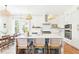 Stylish kitchen island with bar seating, pendant lights, and modern appliances in an open layout at 74 Sandbar Ln, Folly Beach, SC 29439