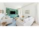 Cozy living room featuring built-in shelving, comfortable seating, and a serene color palette at 74 Sandbar Ln, Folly Beach, SC 29439
