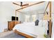 Airy main bedroom with four-poster bed, dresser, and large windows at 74 Sandbar Ln, Folly Beach, SC 29439