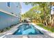 Backyard pool with a deck, stairs to the home, and a fenced yard for privacy at 74 Sandbar Ln, Folly Beach, SC 29439