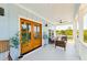 Relaxing porch with comfortable seating, a ceiling fan and views of lush greenery at 74 Sandbar Ln, Folly Beach, SC 29439
