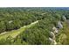 Stunning aerial view of a lush green golf course winding through a beautiful neighborhood surrounded by dense trees at 807 Treeloft Trce, Seabrook Island, SC 29455