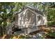 Home exterior shaded by mature trees, showcasing its unique design and natural setting at 807 Treeloft Trce, Seabrook Island, SC 29455