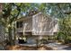 Lovely elevated home featuring a bright exterior, mature landscaping, and private parking at 807 Treeloft Trce, Seabrook Island, SC 29455