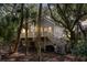 Charming elevated home surrounded by lush trees with stairs leading to a cozy porch at 807 Treeloft Trce, Seabrook Island, SC 29455