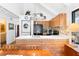 Bright kitchen boasts modern appliances, wood cabinets, and stacked washer/dryer at 807 Treeloft Trce, Seabrook Island, SC 29455