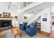 Living room with vaulted ceilings, fireplace, and staircase to a second floor at 807 Treeloft Trce, Seabrook Island, SC 29455
