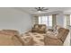 Cozy living room area with large windows and neutral-toned furniture at 9998 Winged Elm St, Ladson, SC 29456