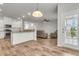 Open-concept living room with views to kitchen and cozy seating area at 9998 Winged Elm St, Ladson, SC 29456