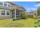 Charming screened porch with outdoor seating, perfect for relaxation and enjoying the backyard view at 9998 Winged Elm St, Ladson, SC 29456