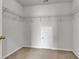 Spacious walk-in closet featuring wire shelving and neutral carpet at 9998 Winged Elm St, Ladson, SC 29456